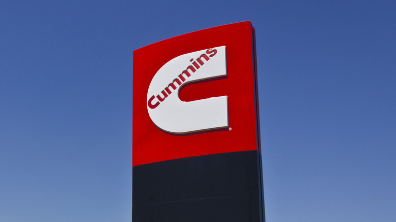 Cummins logo on sign in front of blue sky