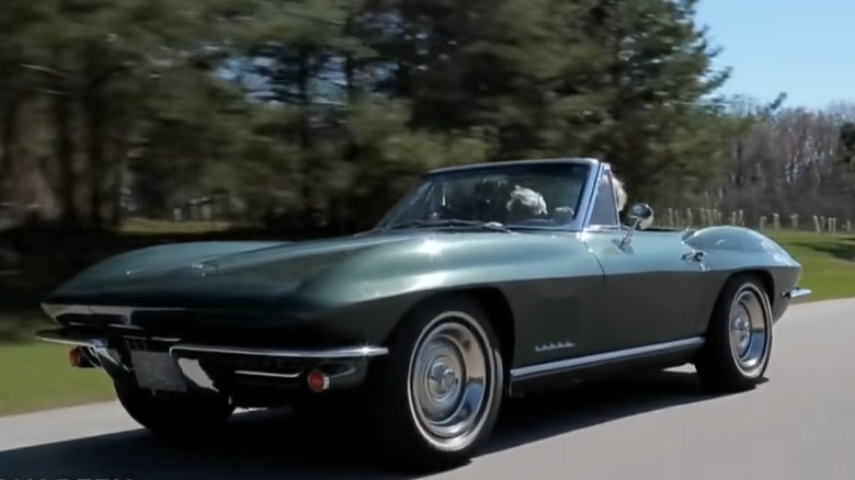 Joe Biden driving his 1967 Corvette Stingray on the road with Jay Leno in the passenger seat.