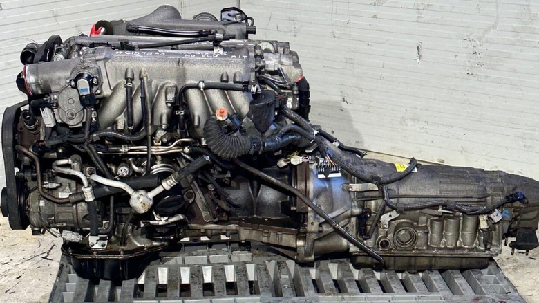 A Toyota 1JZ-GTE engine with transmission from Japan sitting on a pallet