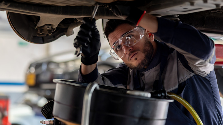 Using a car lift and drain pan