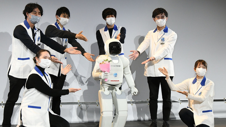 Asimo on stage with flowers