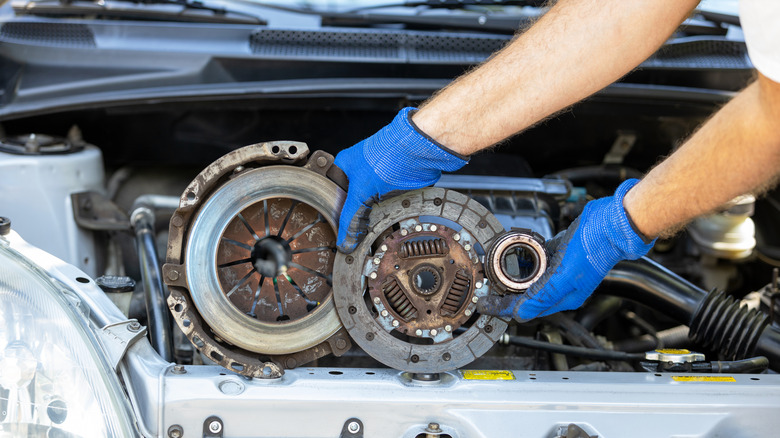 Mechanic holding clutch housing components