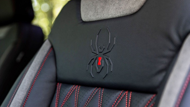 Black Widow logo embroidered on driver seat headrest