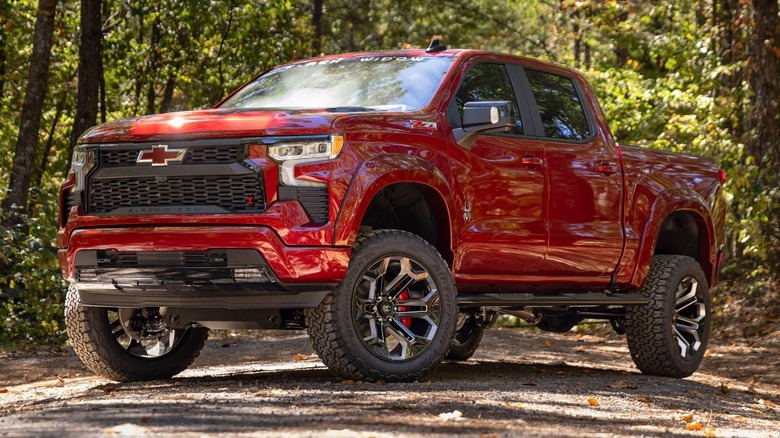 The Chevrolet Silverado 1500 Black Widow parked in a forest