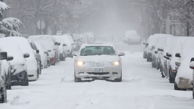 A car driving in the snow