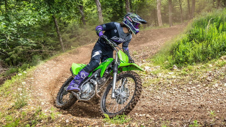 person riding Kawasaki dirt bike