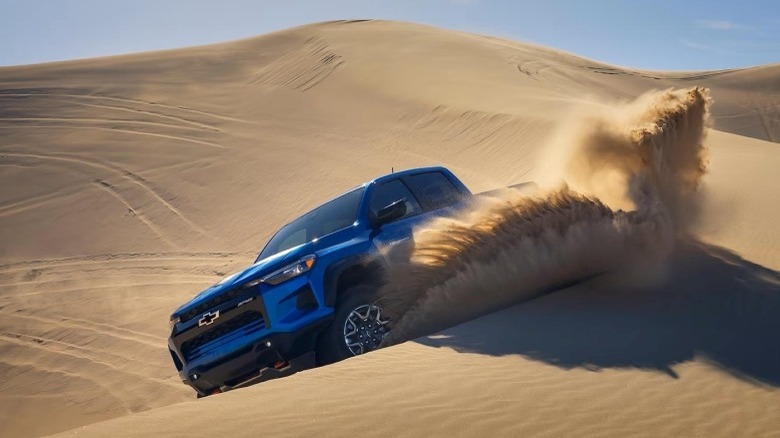 Blue 2024 Chevy Colorado BR2 in sand dunes