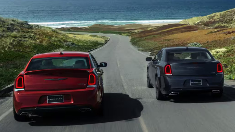 Two 2023 Chrysler 300s driving on road