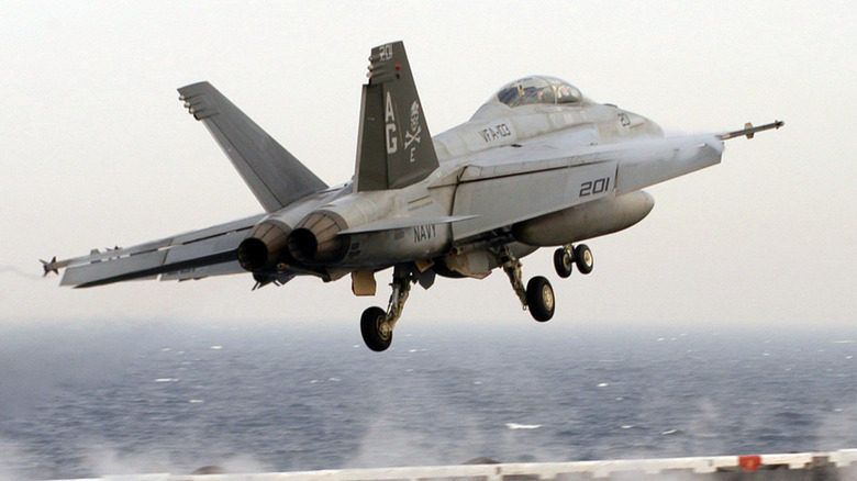 An F/A-18F Super Hornet taking off from an aircraft carrier