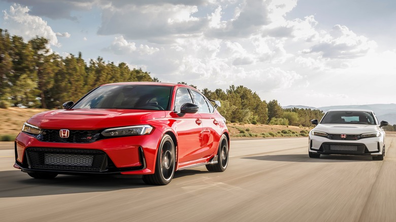 Two Honda Civic Type R cars driving on track