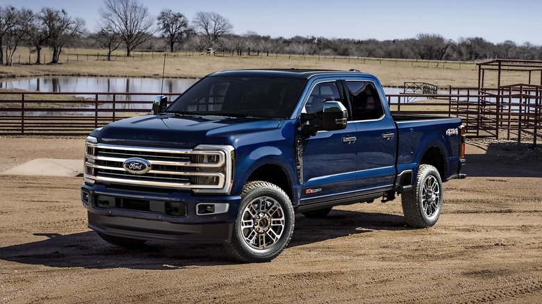 blue 2025 Ford Super Duty truck parked in dirt