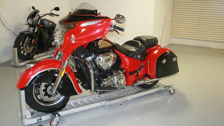 A cruiser bike resting on a motorcycle dolly