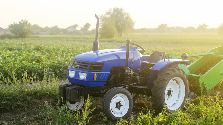 Blue tractor in countryside