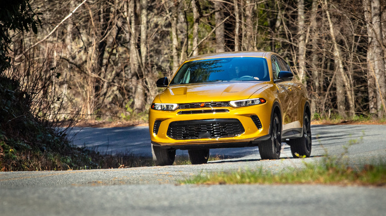 Yellow Dodge Hornet on the road