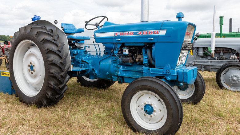 A blue Ford 4000 tractor parked on grass