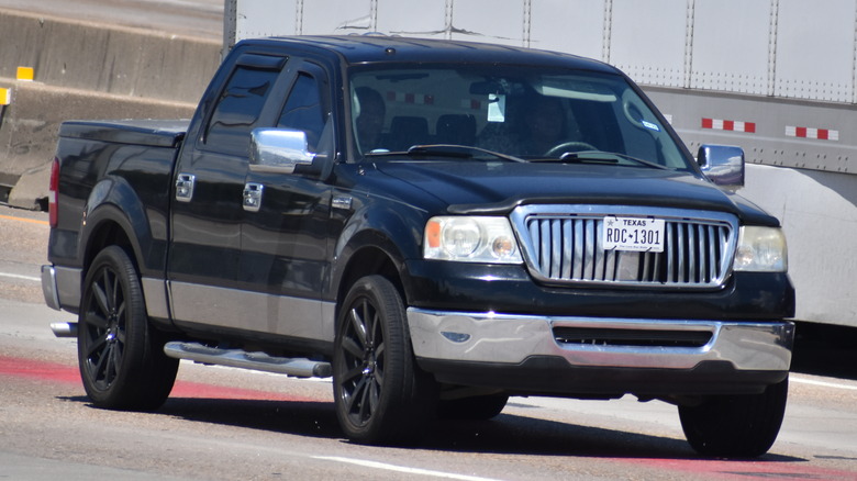 Lincoln Mark LT cruising on highway, front-right view