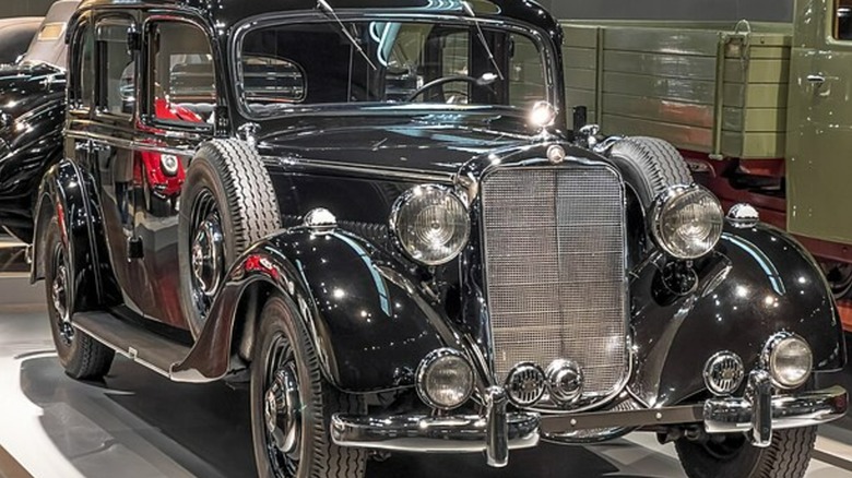 A Mercedes-Benz 260 D parked in a showroom