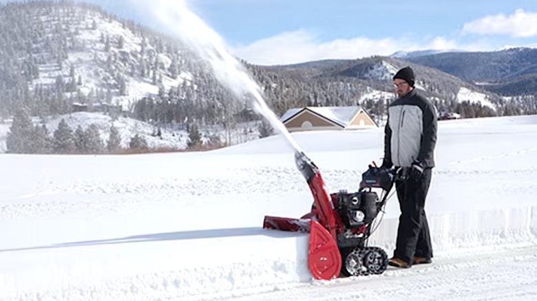 Man using Honda snowblower to clear snow