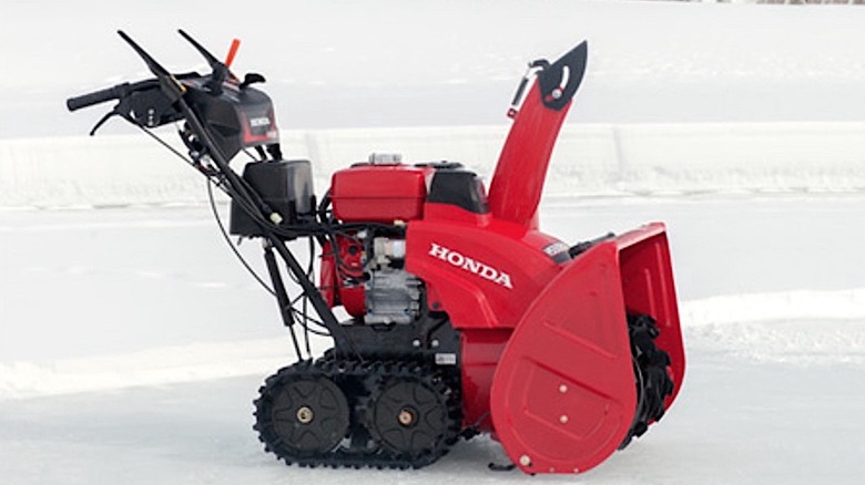 Honda snowblower sitting in the snow