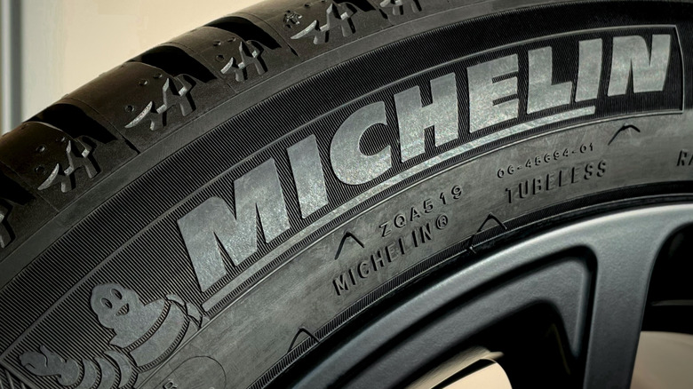 Close-up of Michelin logo on a tire