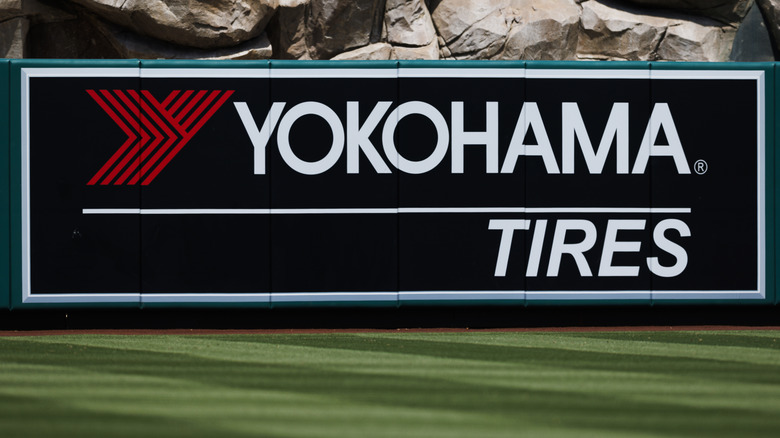 The Yokohama Tire brand and logo displayed near a rocky feature wall