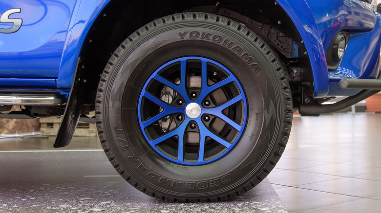 A Yokohama Geolandar tire on a blue Toyota Hilux