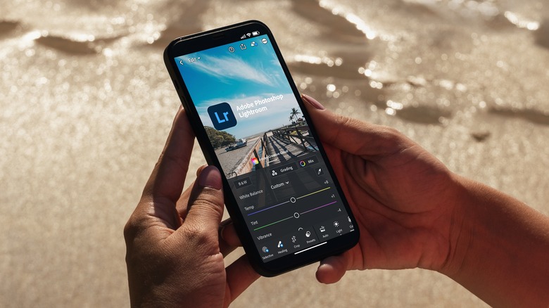 person using Adobe Lightroom Mobile