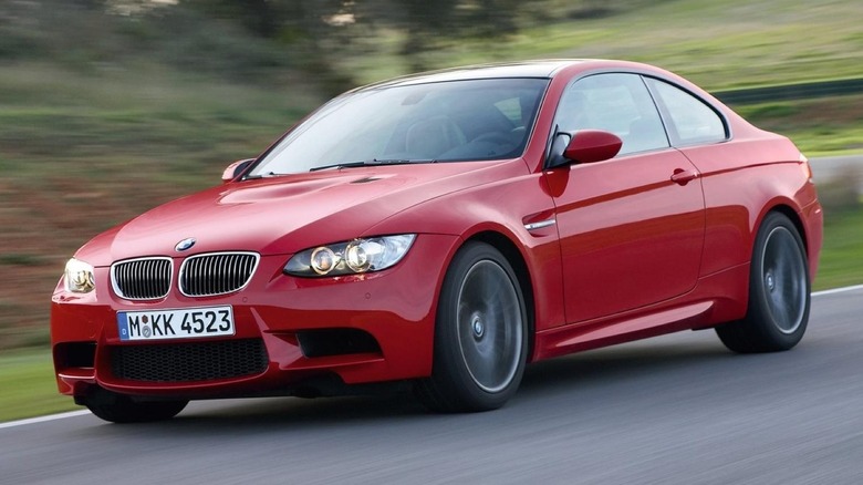 Red BMW M3 coupe driving