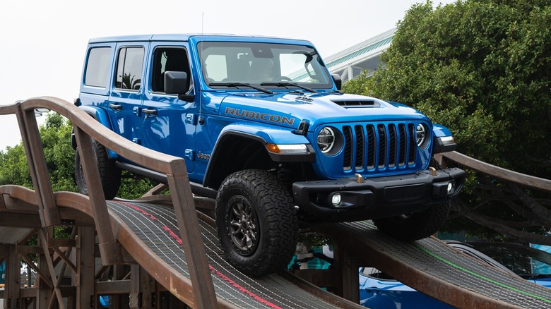 A Jeep Wrangler Rubicon 392 navigating an obstacle on a test track