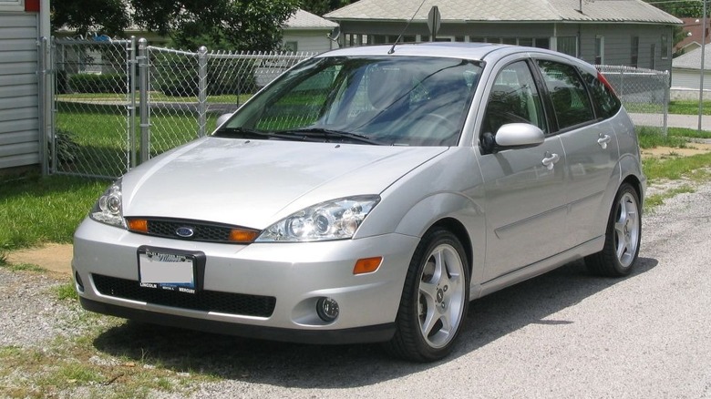 2003 Ford SVT Focus parked next to house