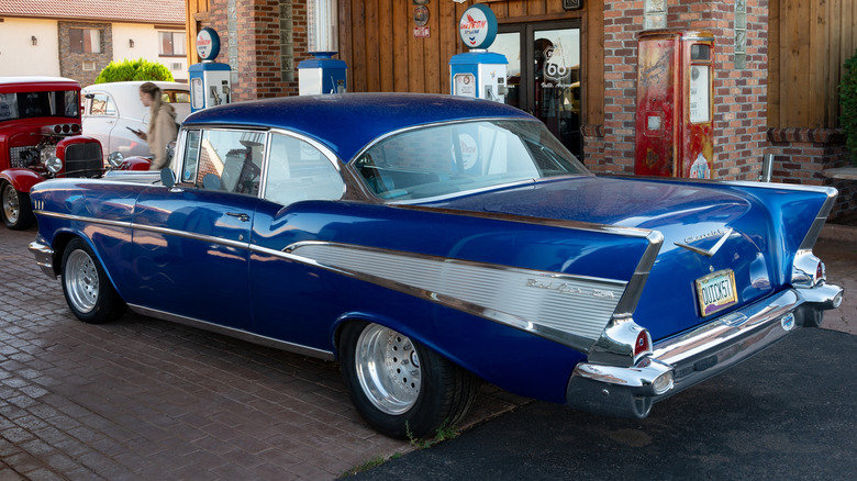 '57 Chevy Bel Air parked on garage forecourt