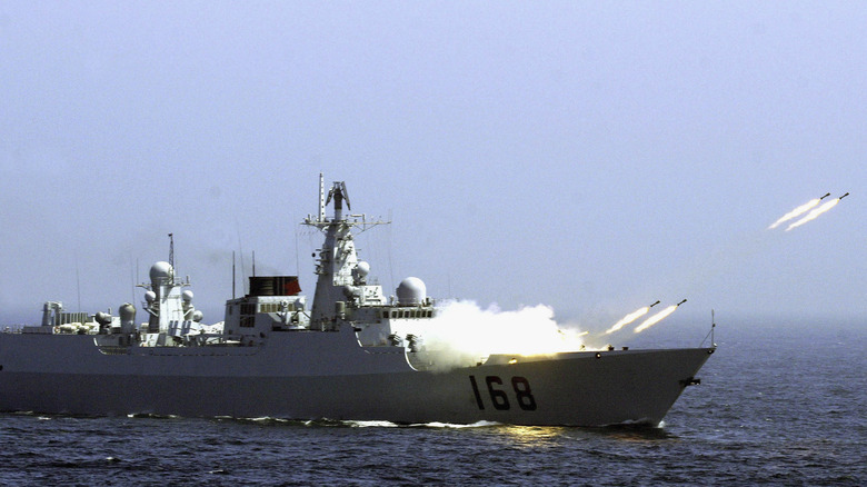 A Chinese destroyer fires rockets off its bow