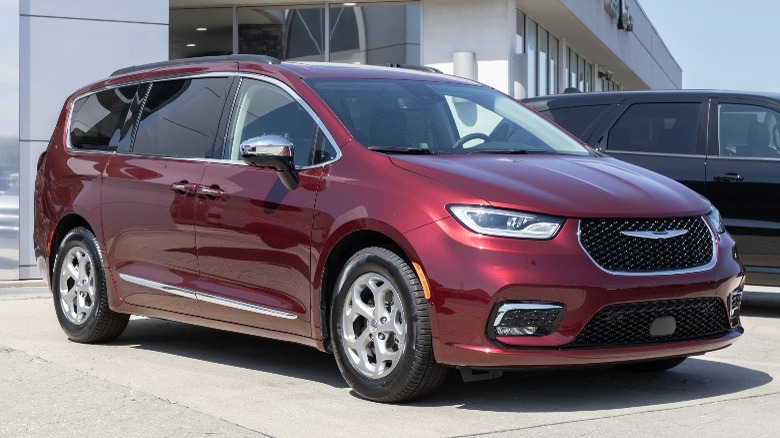 Chrysler Pacifica three quarters front angle view in dark red