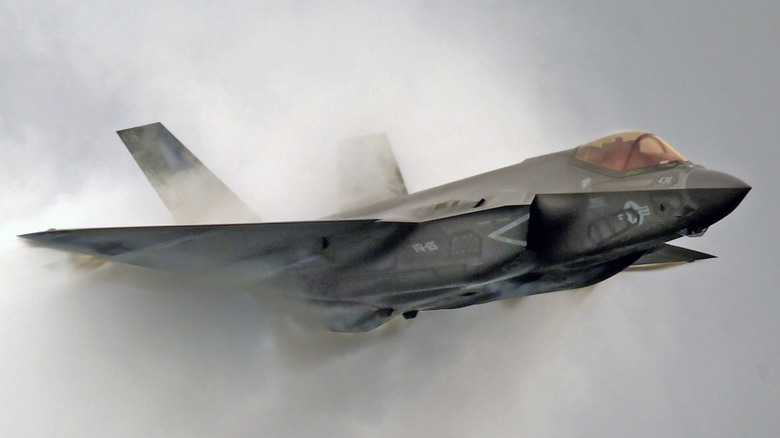 An F-35 Lightning II jet fighter breaks the sound barrier.