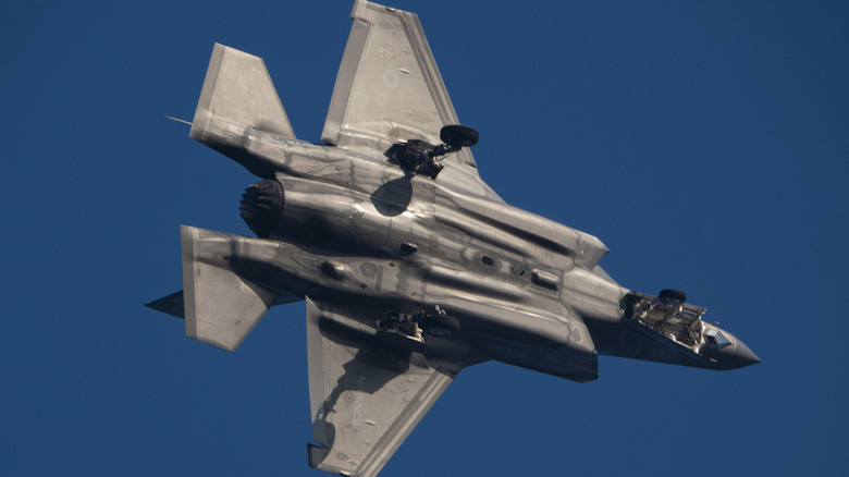 A U.S. Marines F-35 Lightning II turning in the sky.