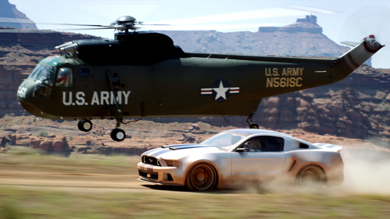 Shelby GT500 racing a helicopter