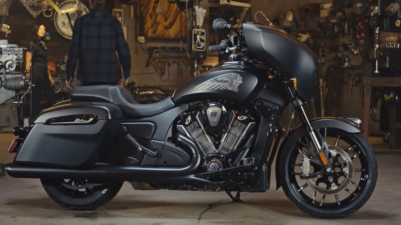 A black 2025 Indian motorcycle featuring the PowerPlus 112 engine parked inside a garage