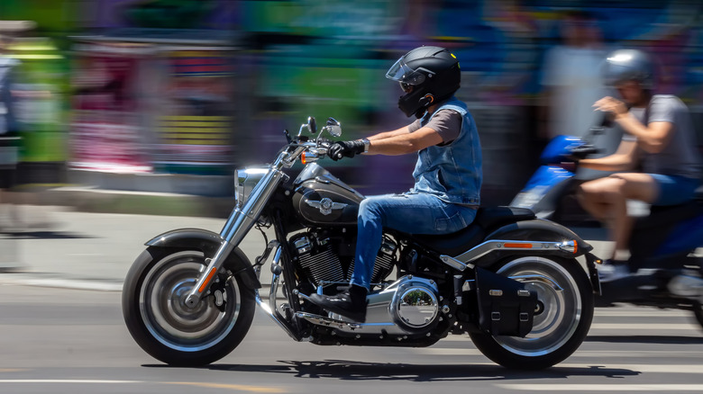 Person riding Harley-Davidson Fat Boy