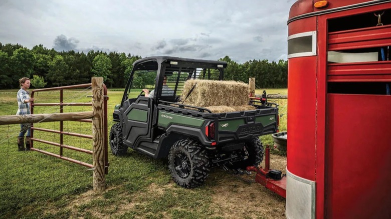 John Deere Gator XUV Towing A Trailer