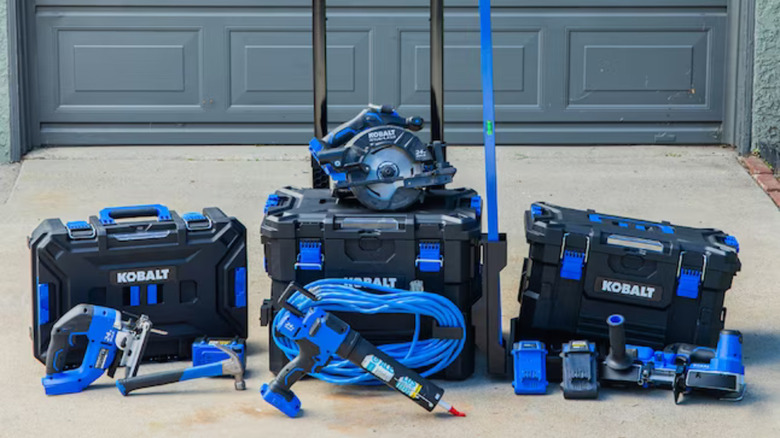 Kobalt toolboxes lined up outside in front of a garage door