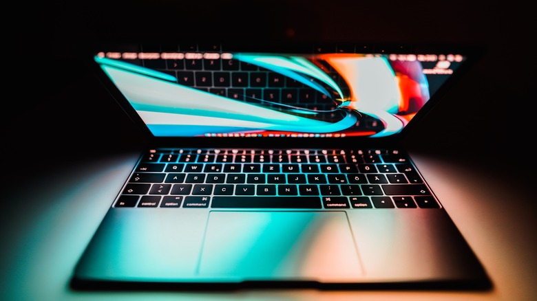 14-inch MacBook illuminating dark room 