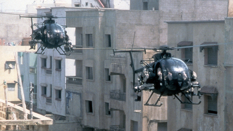 Two helicopters approach combat in the 2001 film "Black Hawk Down."