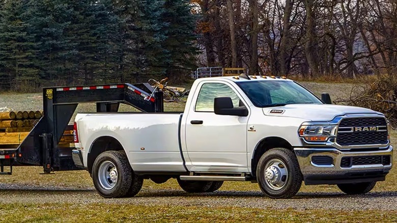 A Ram 3500 towing a gooseneck trailer.