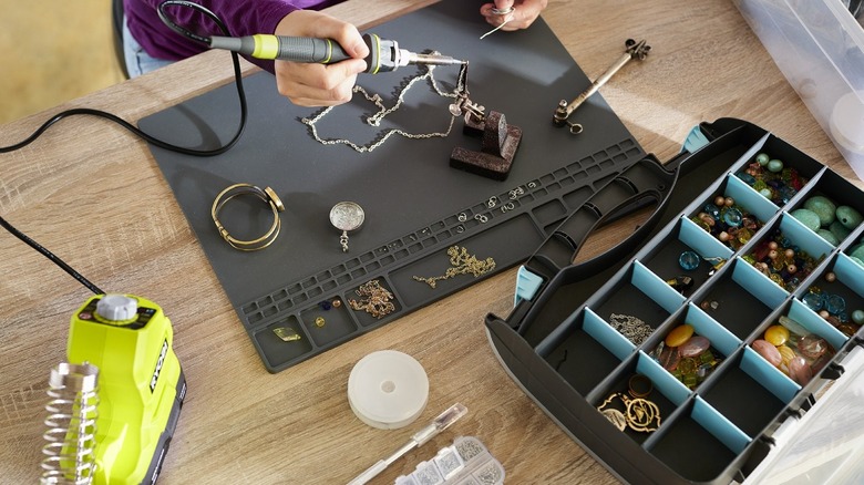 Person soldering jewelry