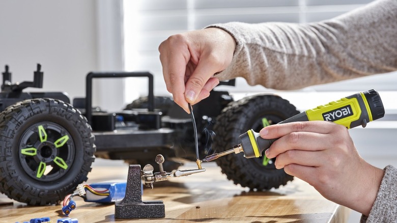 Person soldering their RC car