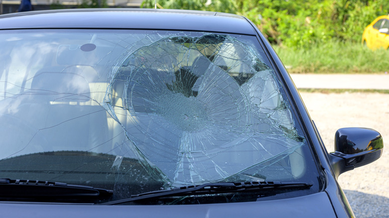 A car with a smashed windshield.