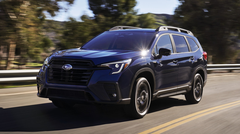 Dark blue 2023 Subaru Ascent driving