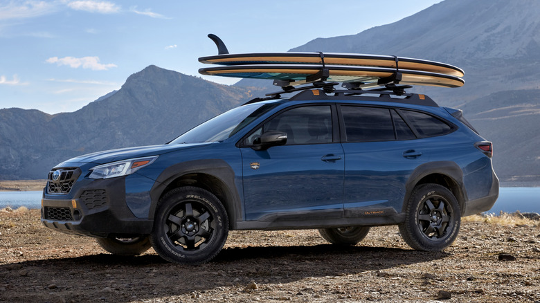 Blue 2024 Subaru Outback Wilderness parked on dirt