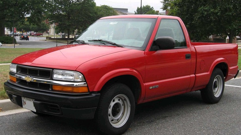 Red Chevy S-10 pickup parked on street