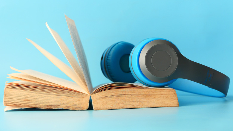 Headphones laying on a paperback book